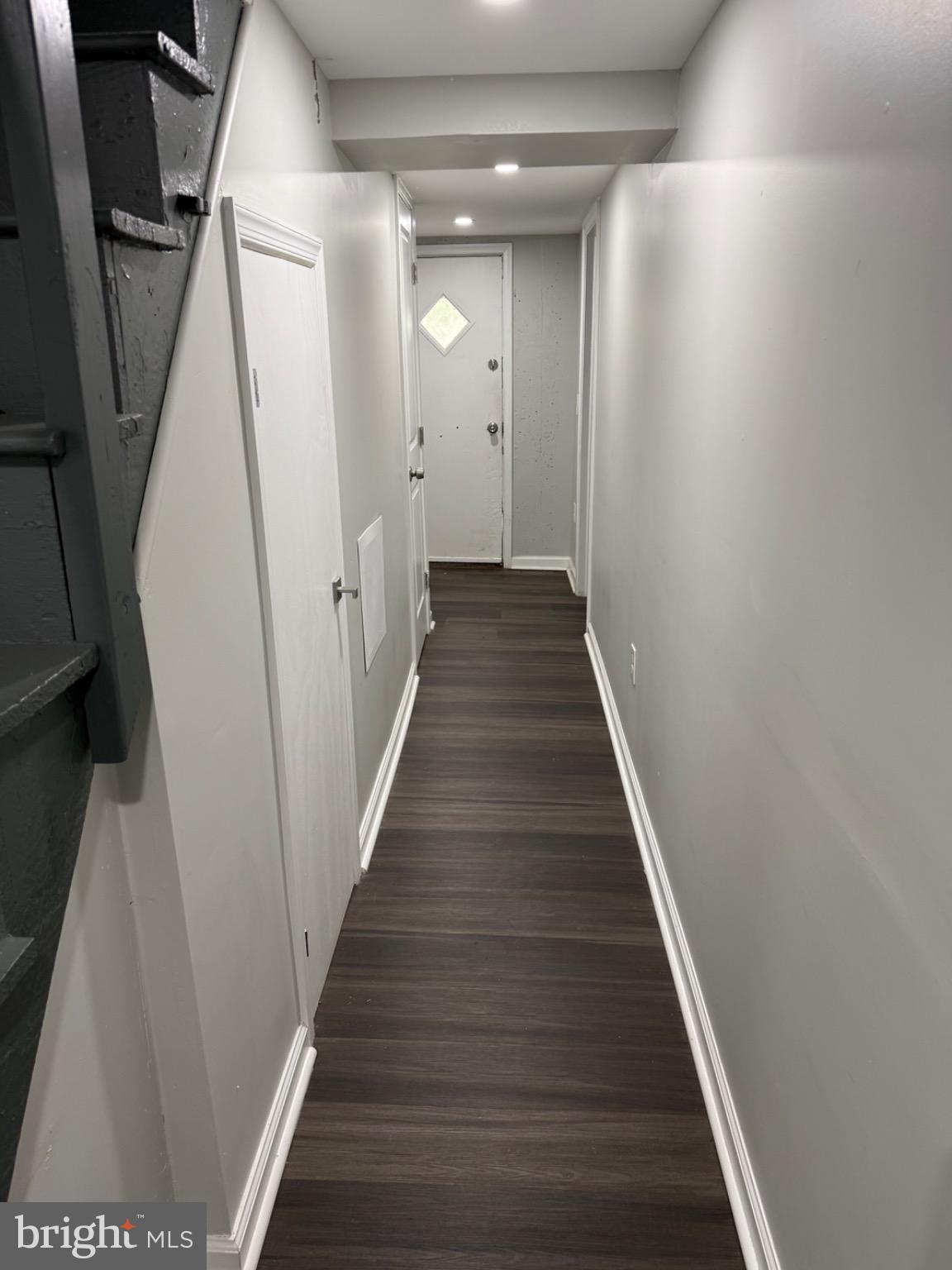 607 Littlecroft Road Upper Darby, PA 19082 - Photo 22 of 34 a view of a hallway with wooden floor and staircase