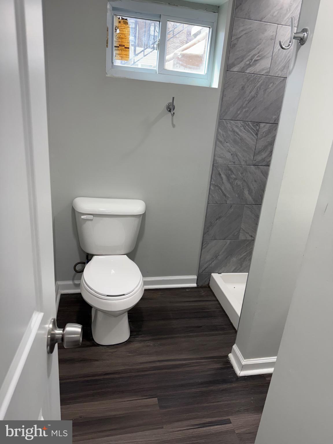 607 Littlecroft Road Upper Darby, PA 19082 - Photo 24 of 34 a white toilet sitting next to a small window
