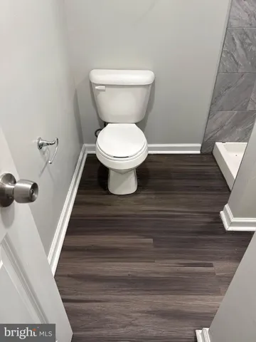 a bathroom with a toilet and a sink