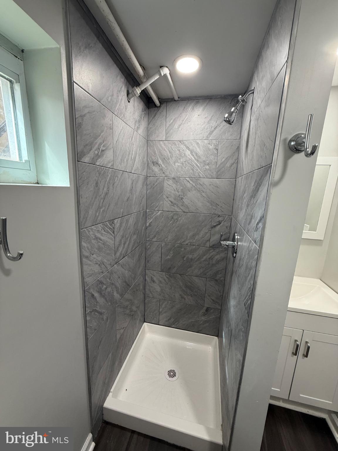 607 Littlecroft Road Upper Darby, PA 19082 - Photo 26 of 34 a bathroom with a tub shower vanity and a sink