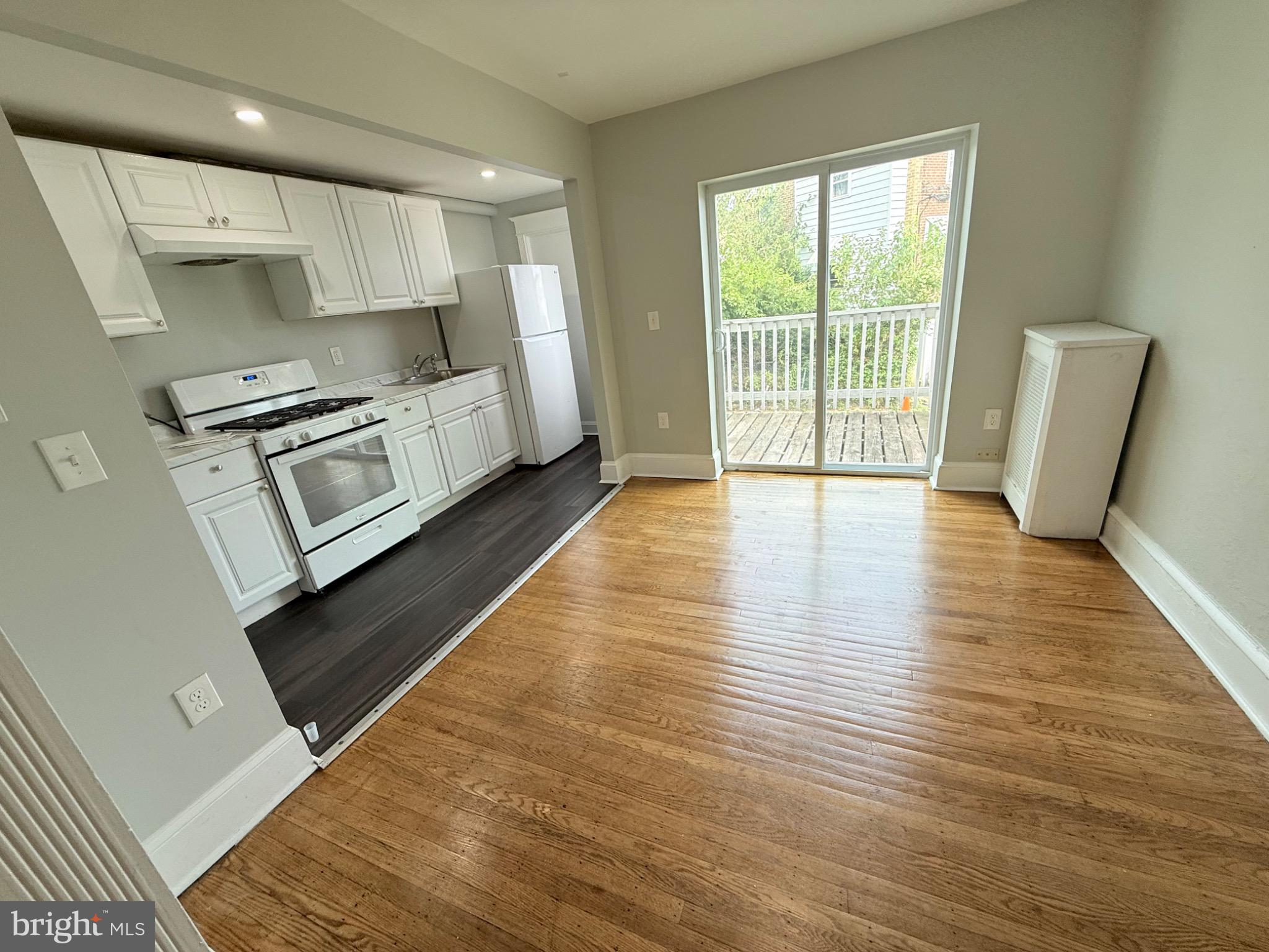 607 Littlecroft Road Upper Darby, PA 19082 - Photo 5 of 34 a kitchen with a stove a sink and a microwave
