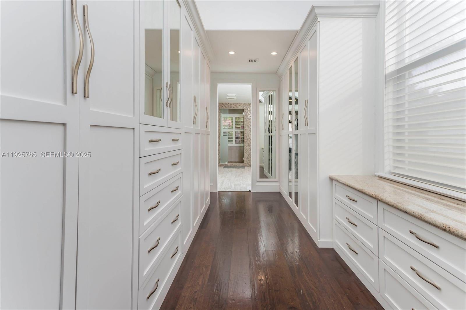 1962 Southwest 185th Avenue Miramar, FL 33029 - Photo 25 of 55 a bathroom with a double vanity sink and a large mirror
