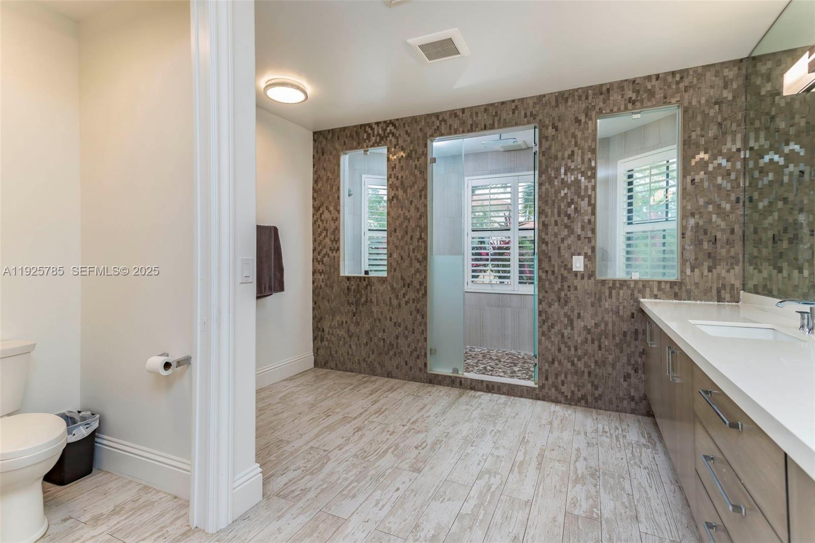 1962 Southwest 185th Avenue Miramar, FL 33029 - Photo 27 of 55 a bathroom with a sink a toilet and shower
