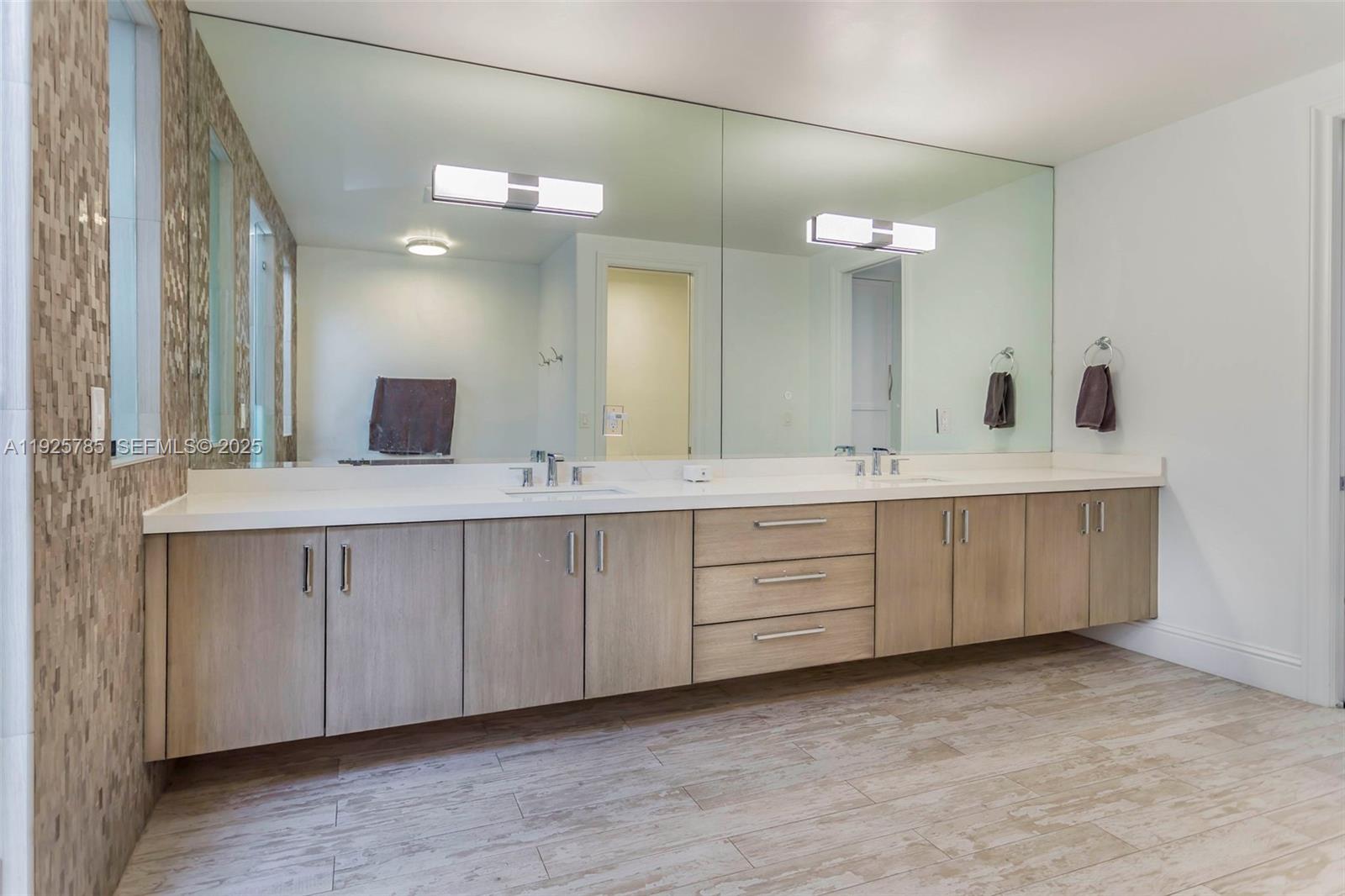 1962 Southwest 185th Avenue Miramar, FL 33029 - Photo 28 of 55 a bathroom with a double vanity sink and a mirror