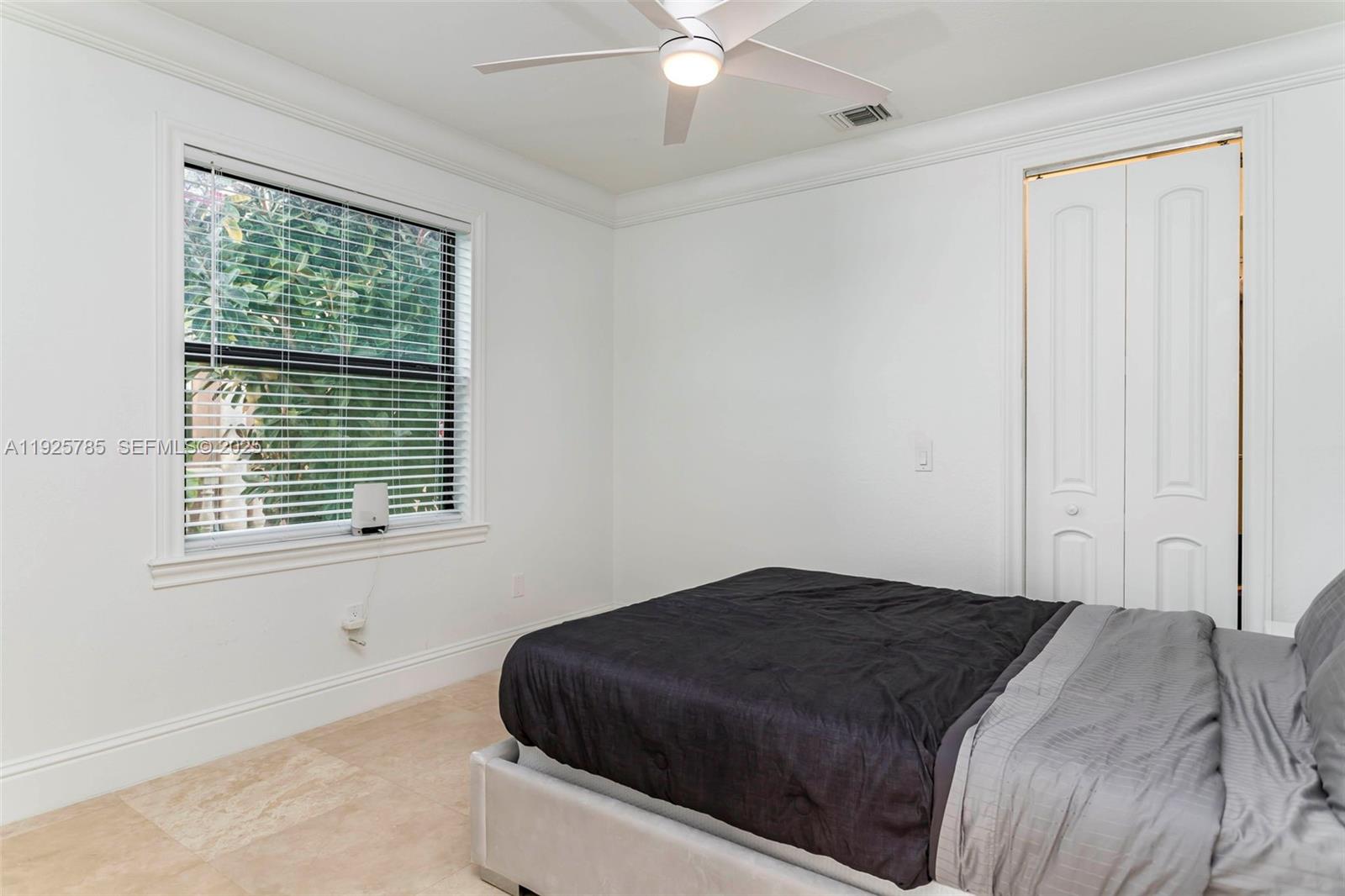 1962 Southwest 185th Avenue Miramar, FL 33029 - Photo 34 of 55 a bedroom with a bed and a window