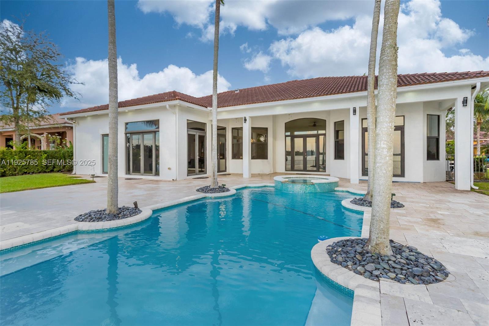 1962 Southwest 185th Avenue Miramar, FL 33029 - Photo 38 of 55 a swimming pool with outdoor seating