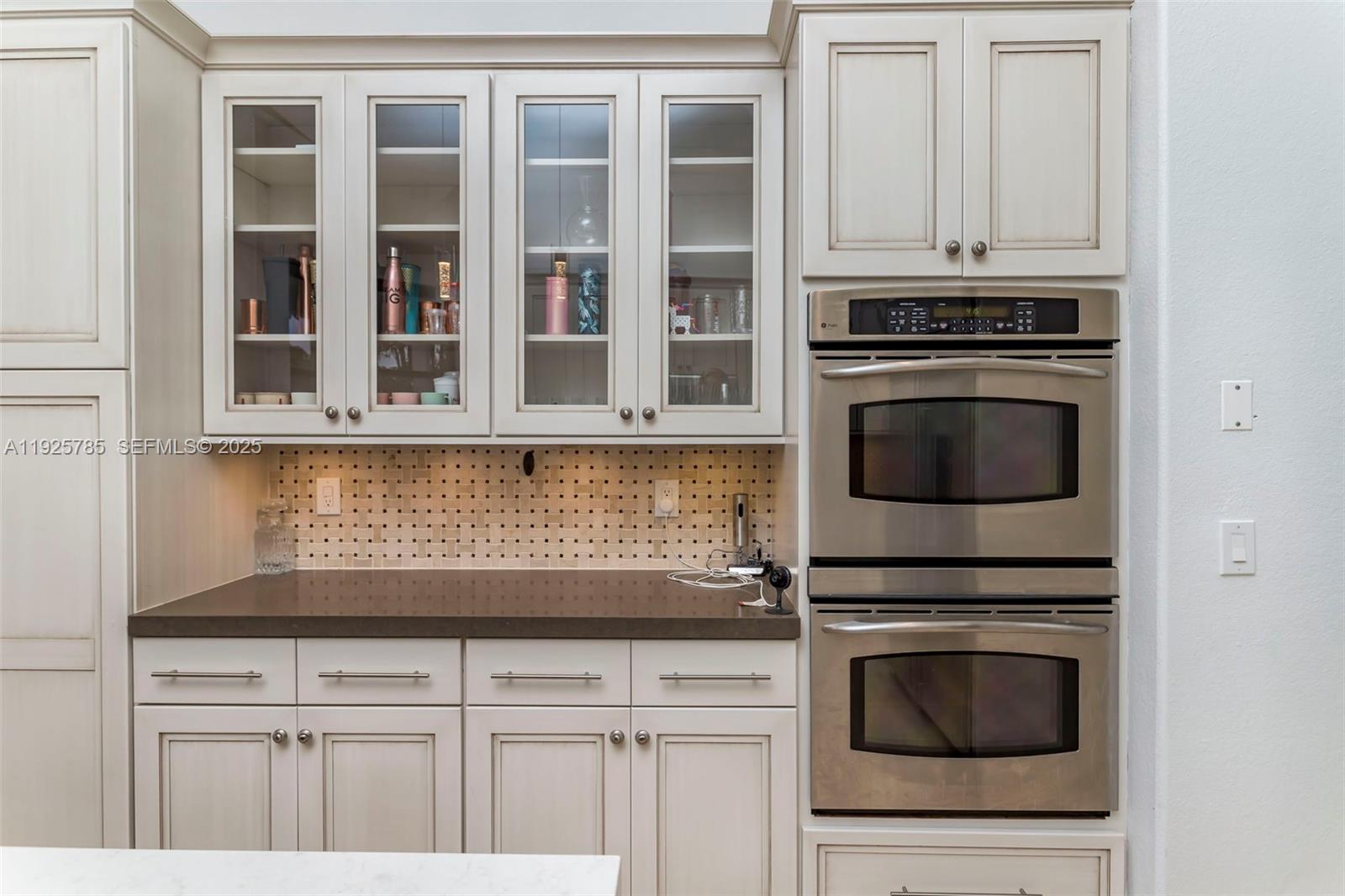 1962 Southwest 185th Avenue Miramar, FL 33029 - Photo 9 of 55 a kitchen with granite countertop white cabinets and stainless steel appliances