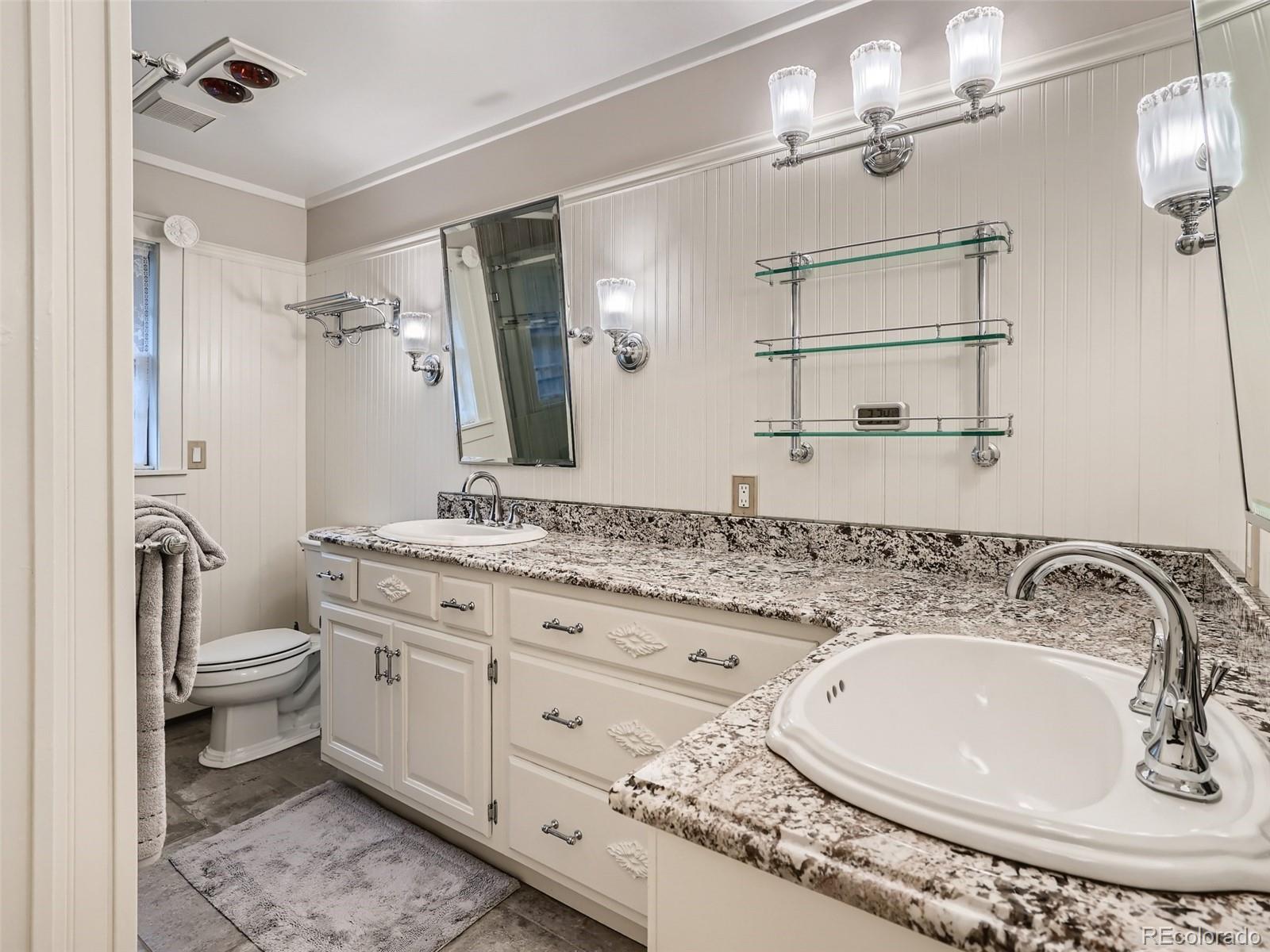 4387 Witter Gulch Road Evergreen, CO 80439 - Photo 14 of 31 a bathroom with a granite countertop sink toilet and shower