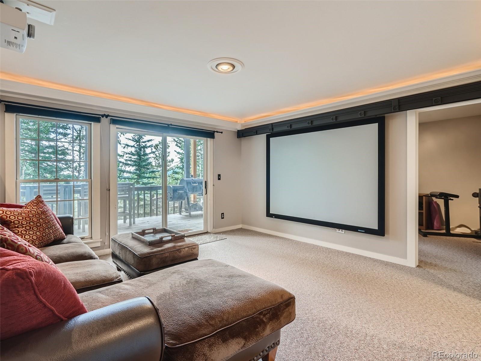 4387 Witter Gulch Road Evergreen, CO 80439 - Photo 17 of 31 a living room with furniture and a window