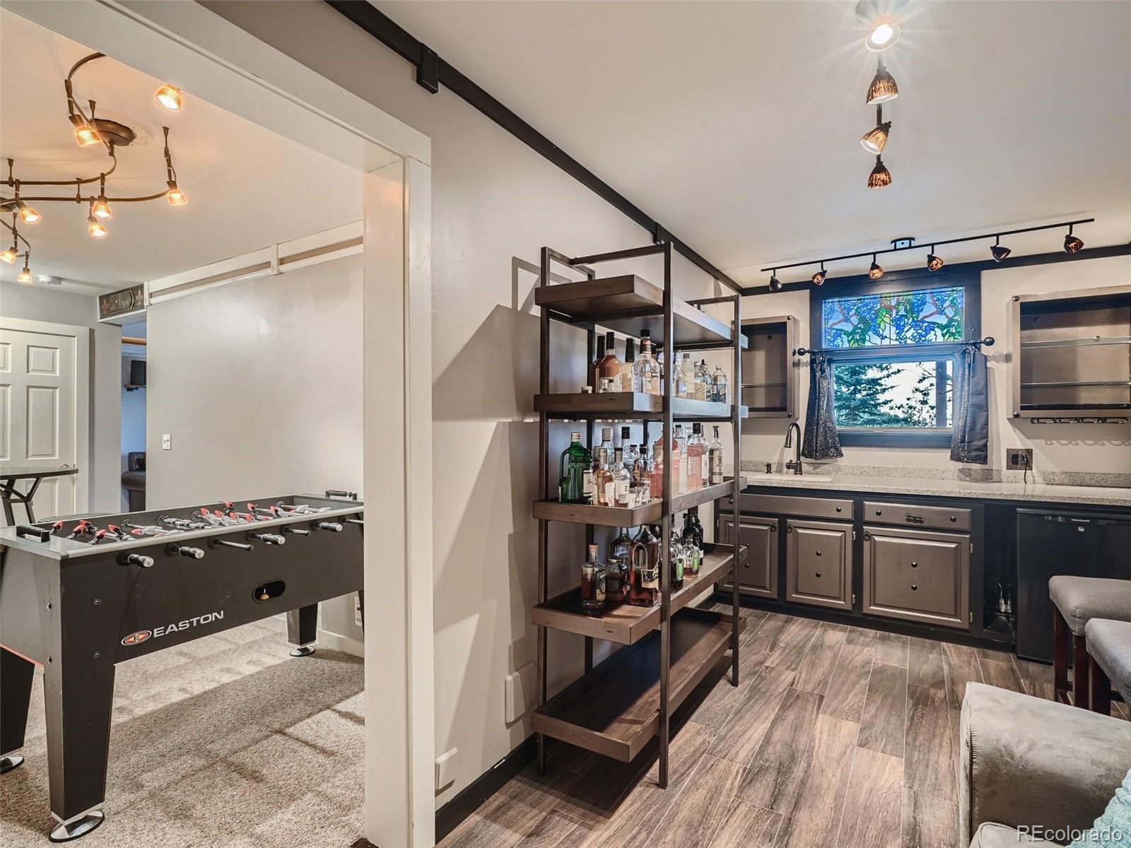 4387 Witter Gulch Road Evergreen, CO 80439 - Photo 19 of 31 a kitchen with a sink stove and refrigerator
