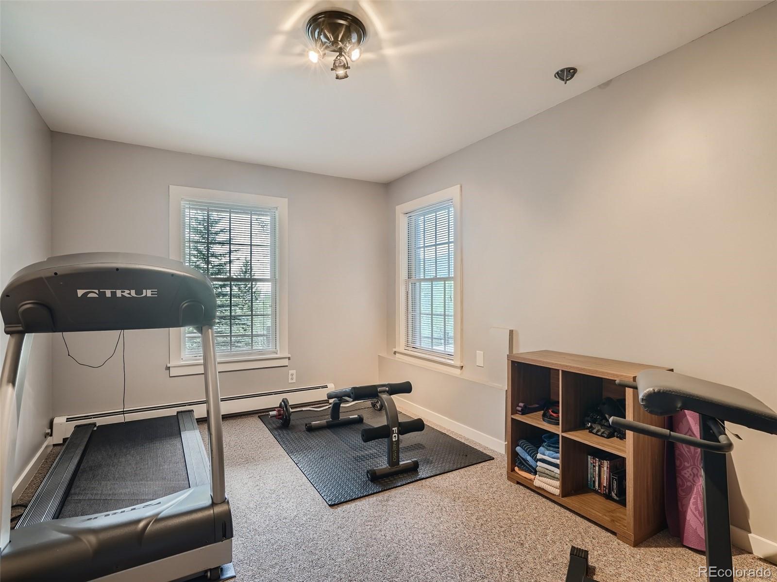 4387 Witter Gulch Road Evergreen, CO 80439 - Photo 21 of 31 a livingroom with furniture and a window