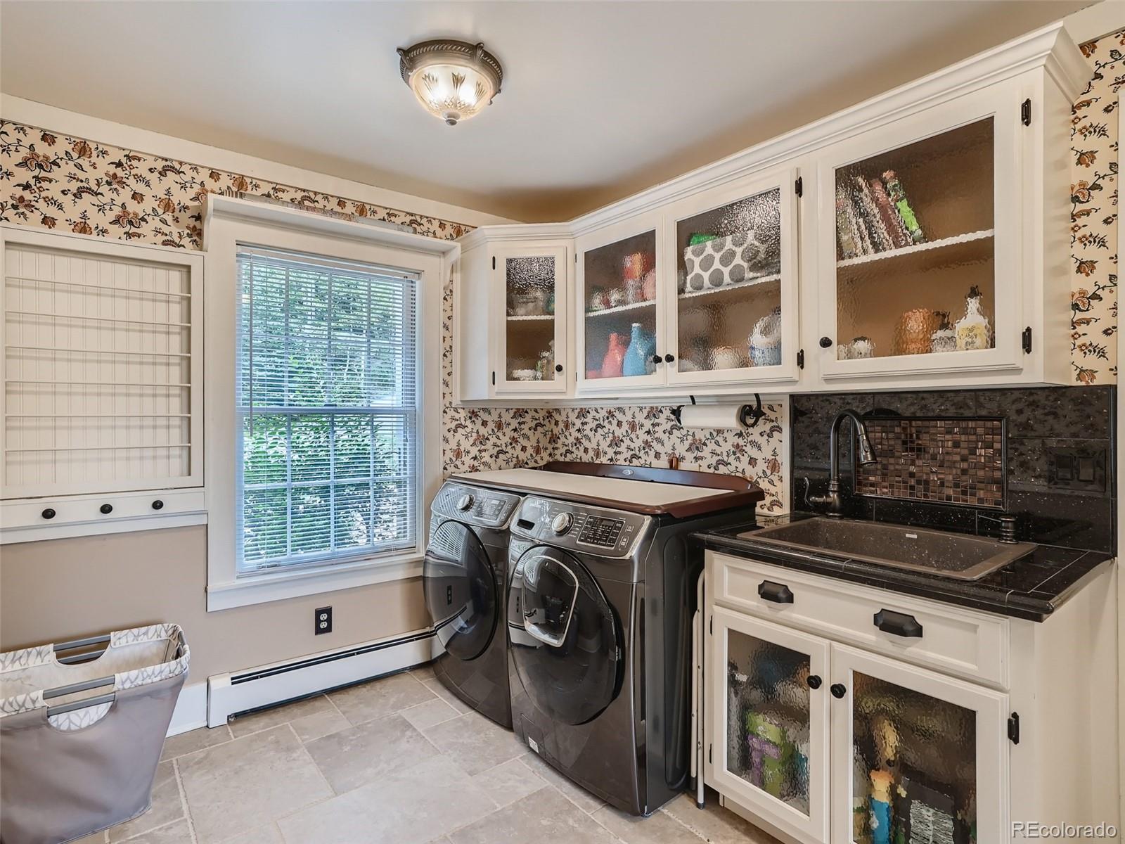 4387 Witter Gulch Road Evergreen, CO 80439 - Photo 23 of 31 a view of livingroom with washer and dryer