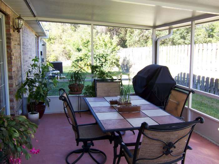 516 Moultrie Wells Road St. Augustine, FL 32086 - Photo 15 of 18 a view of a patio filled with furniture