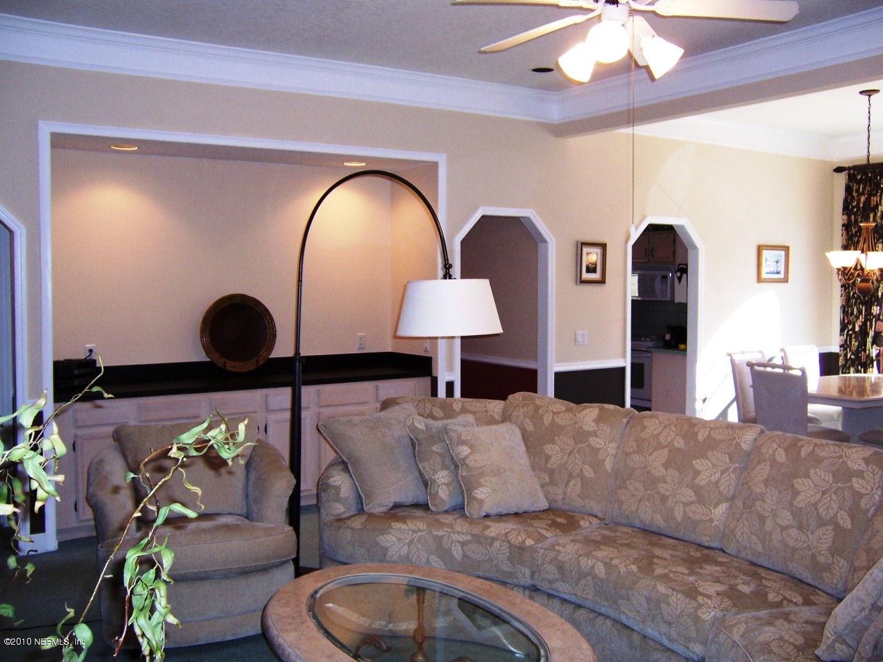 516 Moultrie Wells Road St. Augustine, FL 32086 - Photo 3 of 18 a living room with furniture and a chandelier