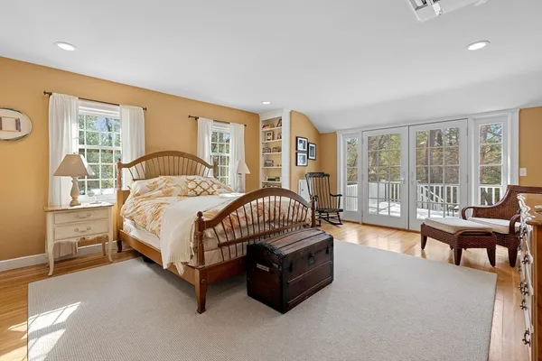 a spacious bedroom with a bed and a couch