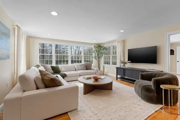 a living room with furniture and a flat screen tv