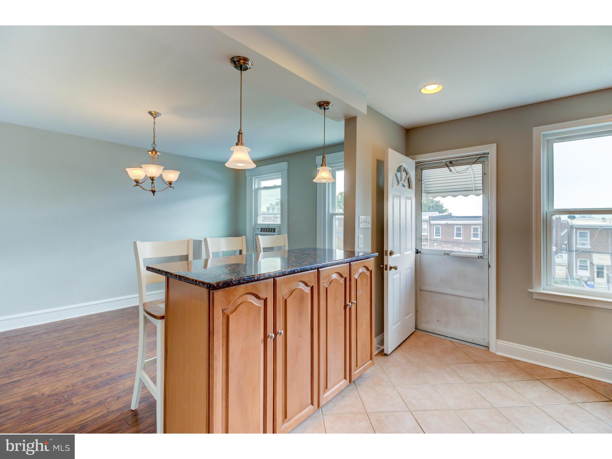 237 Rector Street Philadelphia, PA 19128 - Photo 8 of 23 Breakfast bar with cabinet storage