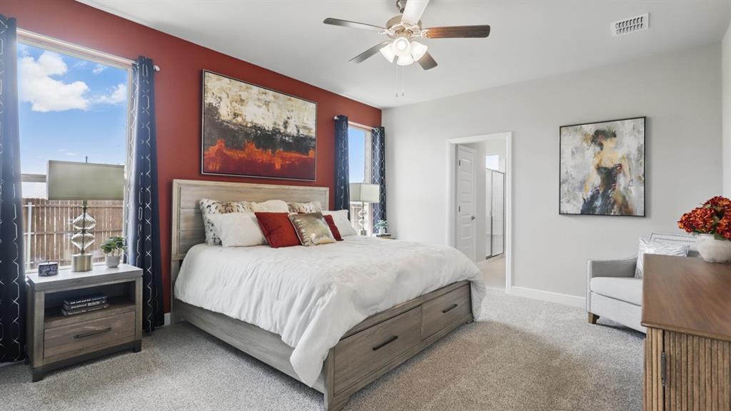 1922 Jackson Street Cleburne, TX 76033 - Photo 15 of 39 a bedroom with a bed and a painting on the wall