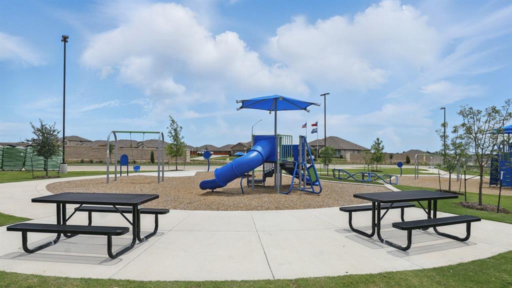 1922 Jackson Street Cleburne, TX 76033 - Photo 32 of 39 a view of a patio with a table and chairs