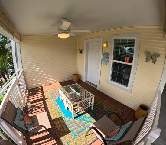 a view of a chairs and table in a balcony