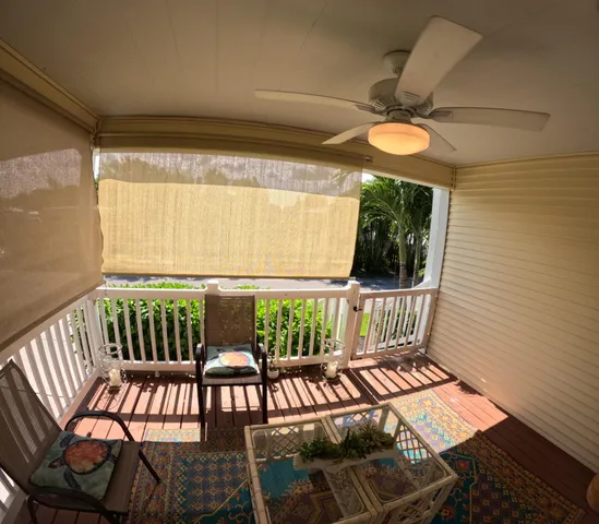 a view of a porch with furniture