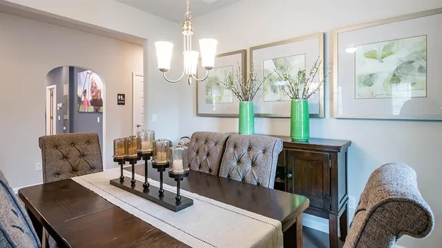 a view of kitchen with dining table and chairs
