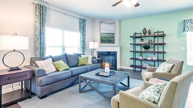 a view of a livingroom with furniture and staircase