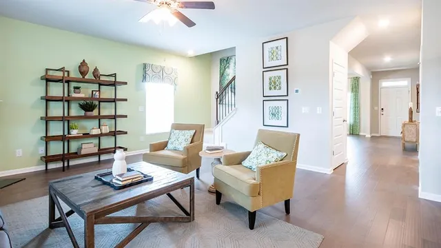 a view of entryway and hall with wooden floor