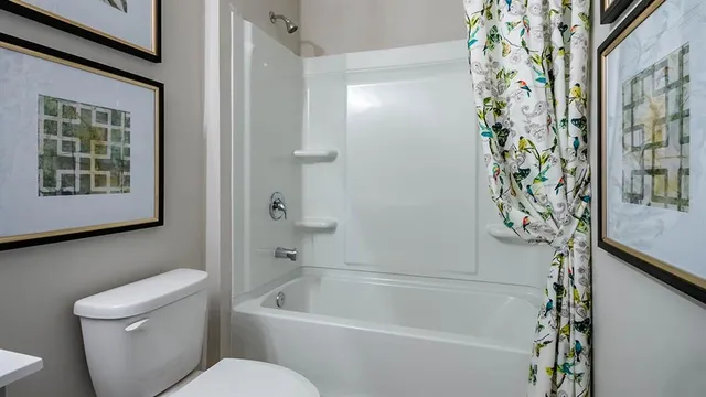 a living room with furniture and a dresser