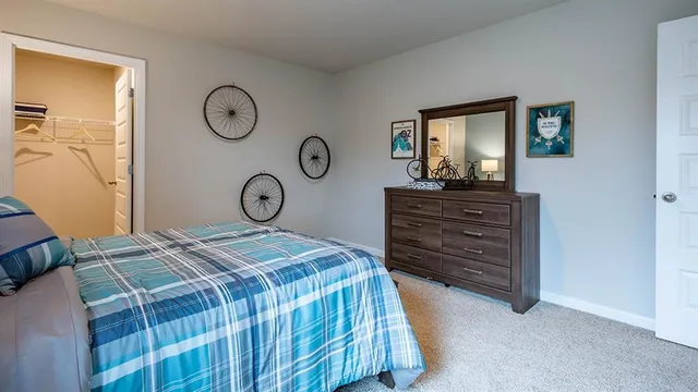 a view of a livingroom with furniture and a window