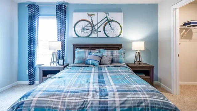 a view of a livingroom with workspace and a window