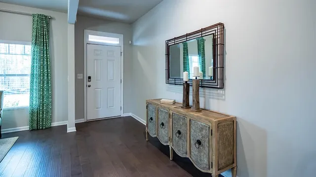 a living room with furniture and a lamp