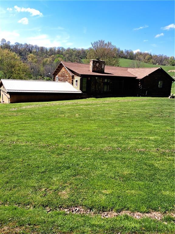 View of rear of house from tree line