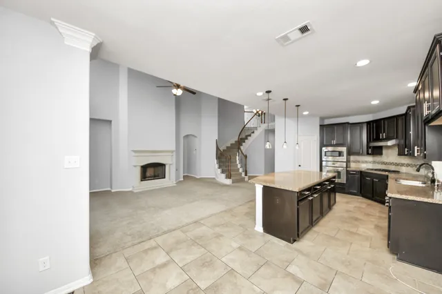 a view of a kitchen with furniture and a fireplace
