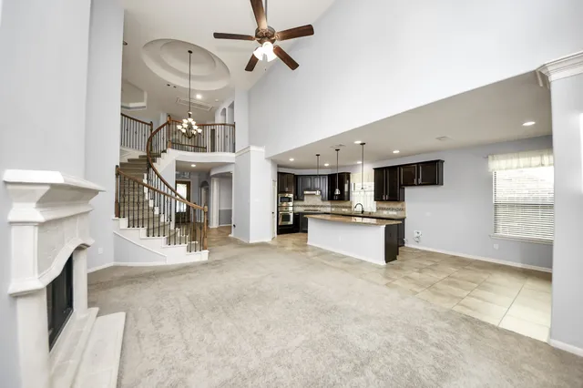 a view of a kitchen with a sink and microwave