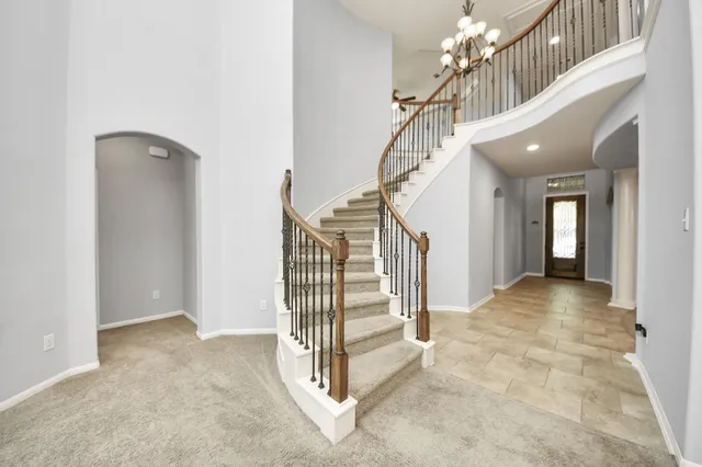a view of entryway and hall with a front door