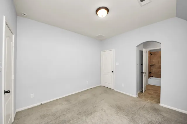 an empty room with a hallway