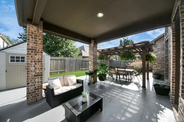 a patio with patio couch and table