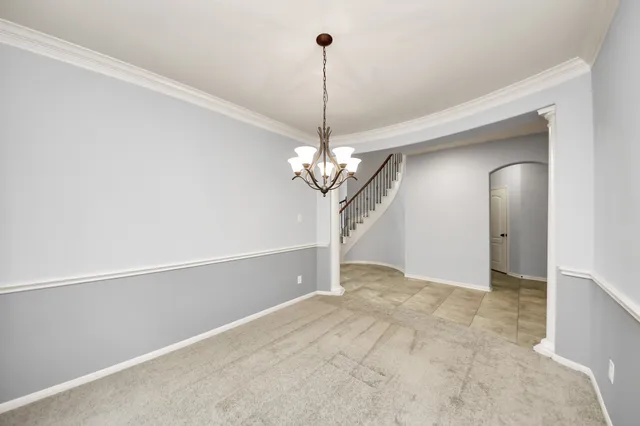 a view of a chandelier in big room