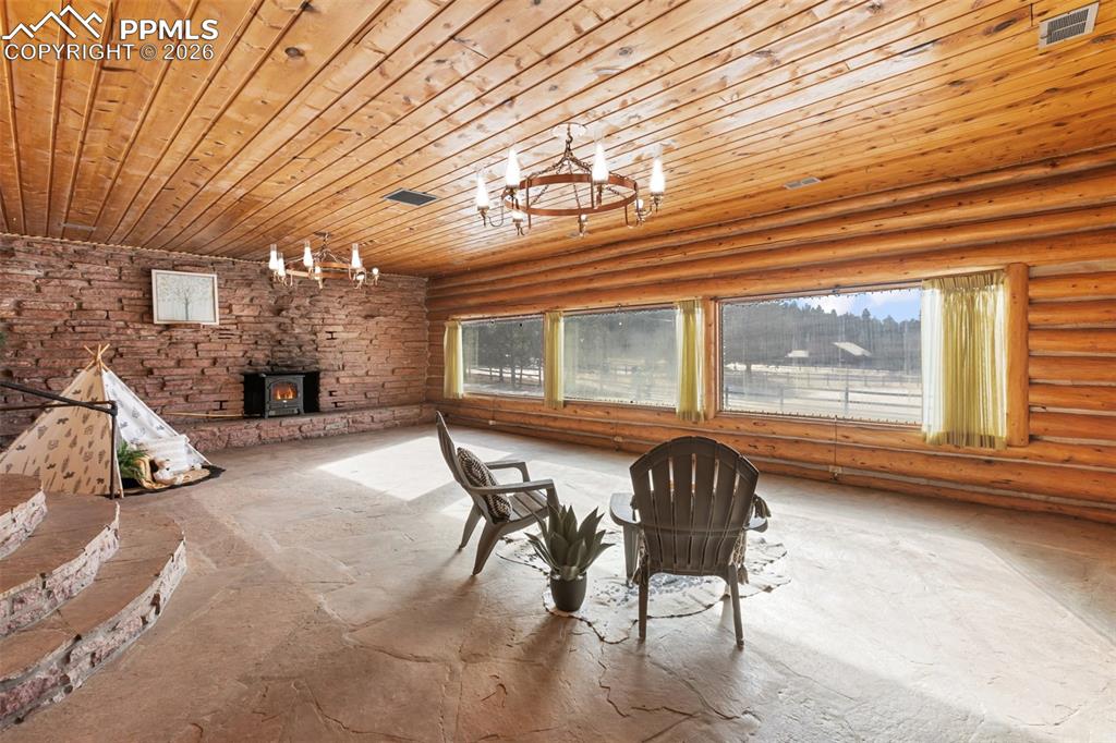 2300 Rampart Range Road Woodland Park, CO 80863 - Photo 12 of 45 a dining room with furniture and window