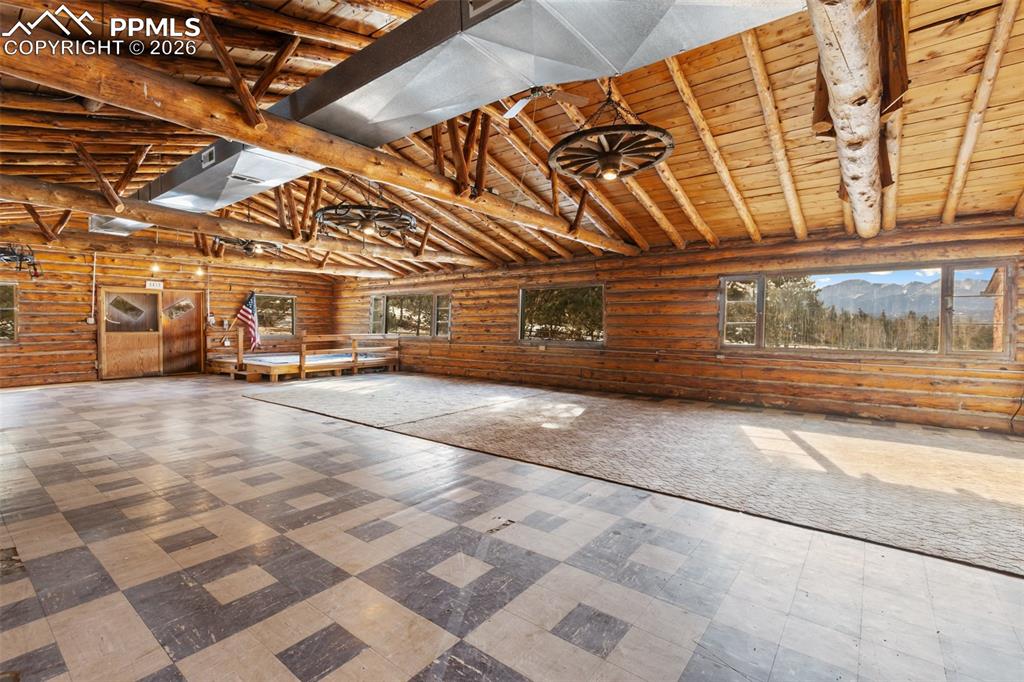 2300 Rampart Range Road Woodland Park, CO 80863 - Photo 20 of 45 a view of a room with wooden walls