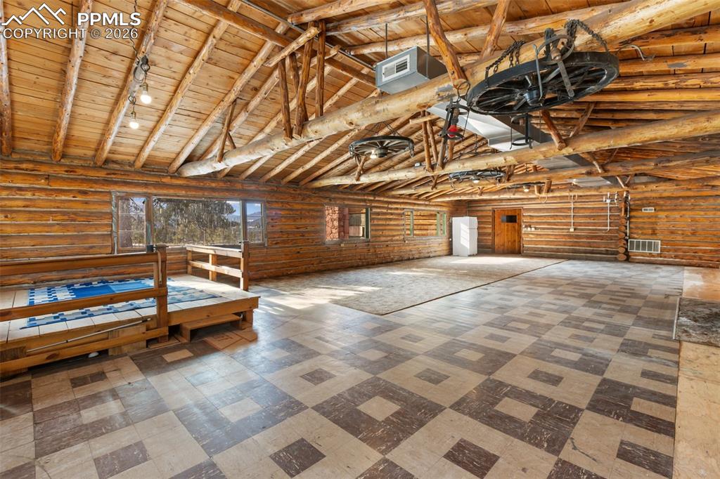 2300 Rampart Range Road Woodland Park, CO 80863 - Photo 22 of 45 a view of a room with wooden floor