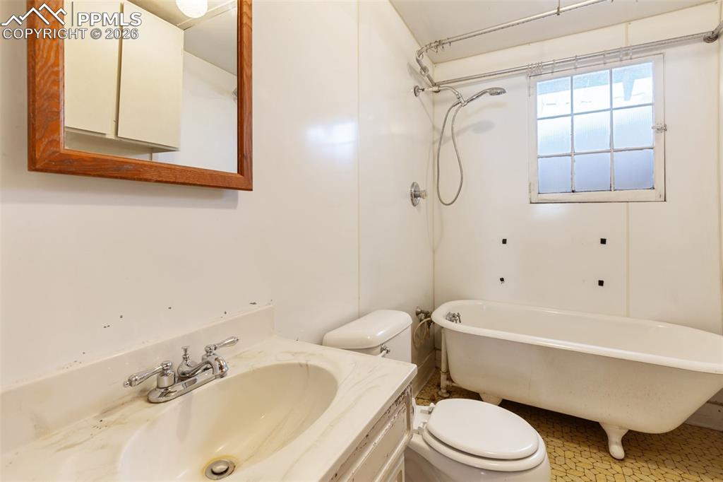 2300 Rampart Range Road Woodland Park, CO 80863 - Photo 38 of 45 a bathroom with a sink toilet and shower
