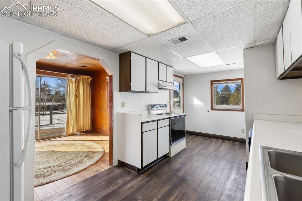 2300 Rampart Range Road Woodland Park, CO 80863 - Photo 40 of 45 a kitchen with stainless steel appliances granite countertop a stove a sink and a refrigerator