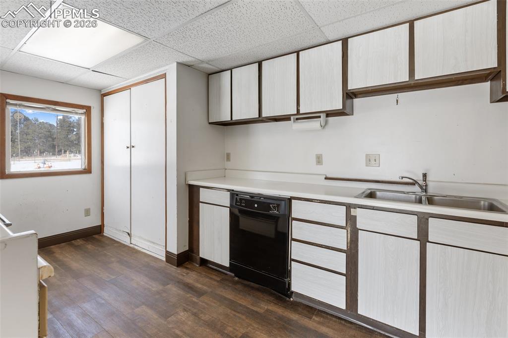 2300 Rampart Range Road Woodland Park, CO 80863 - Photo 41 of 45 a kitchen with stainless steel appliances granite countertop a sink and a stove top oven