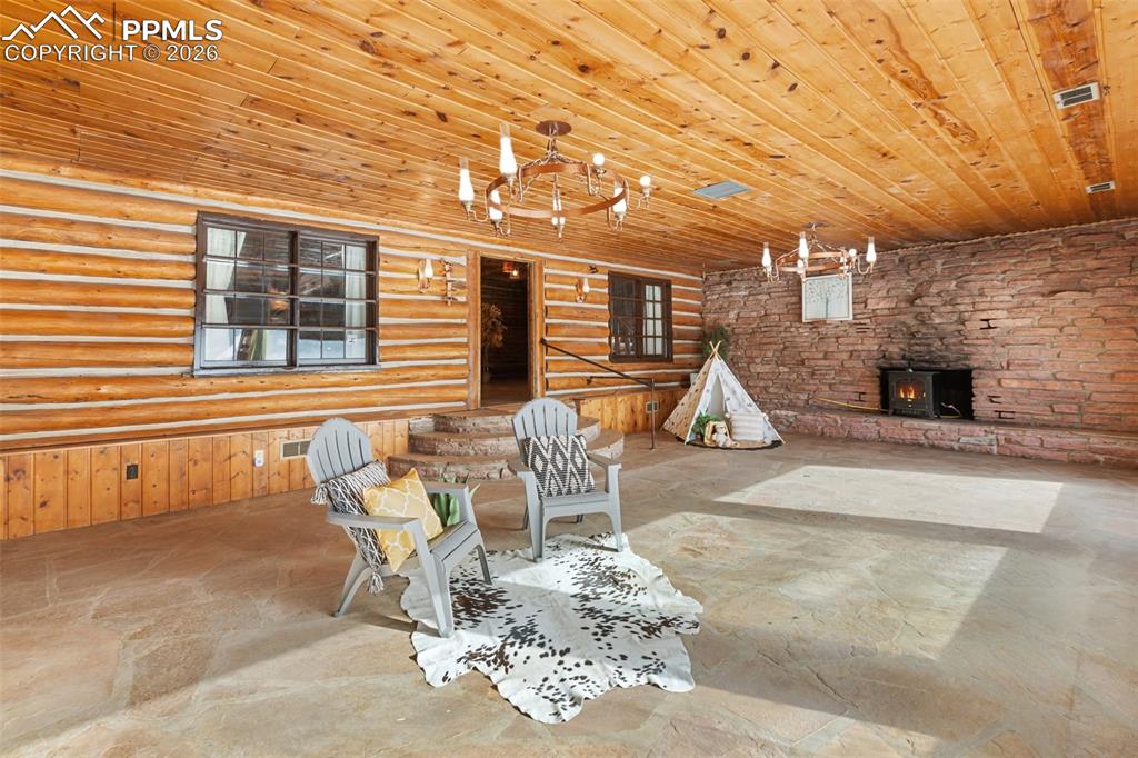 2300 Rampart Range Road Woodland Park, CO 80863 - Photo 10 of 45 a patio with table and chairs