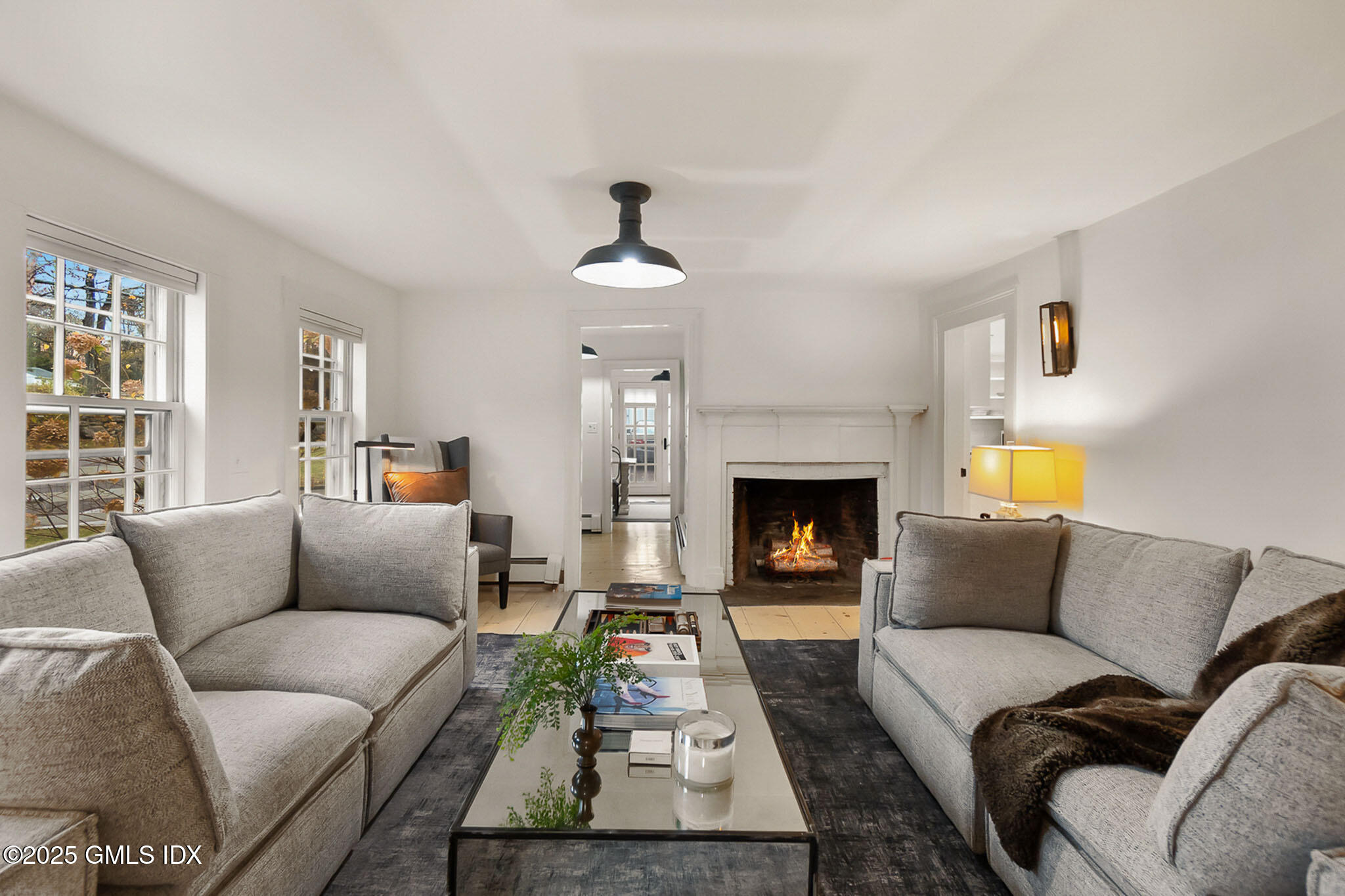 45 Burying Hill Road, Unit COTTAGE Greenwich, CT 06831 - Photo 4 of 19 a living room with furniture and a fireplace