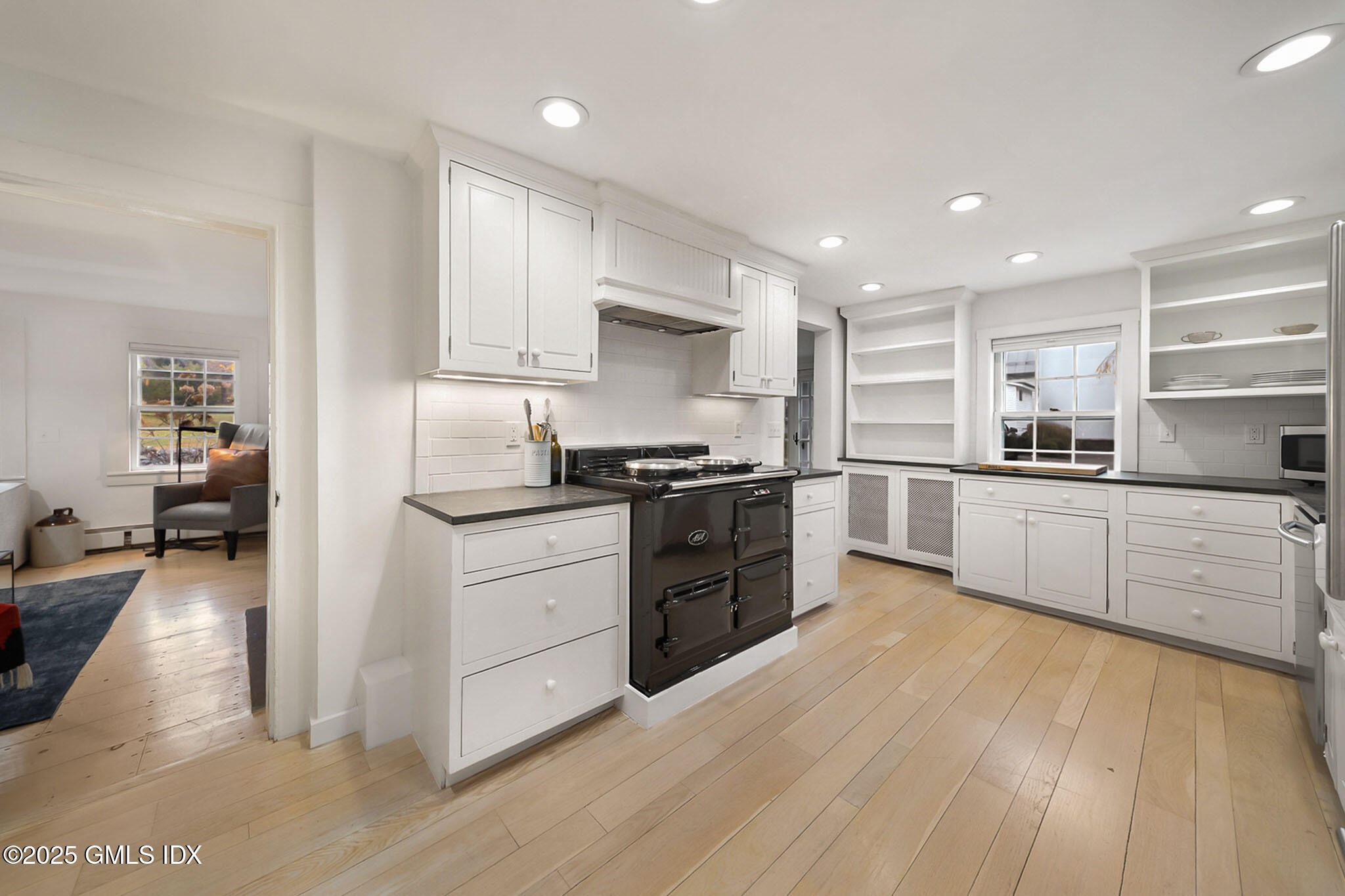 45 Burying Hill Road, Unit COTTAGE Greenwich, CT 06831 - Photo 6 of 19 a kitchen with granite countertop a sink and cabinets