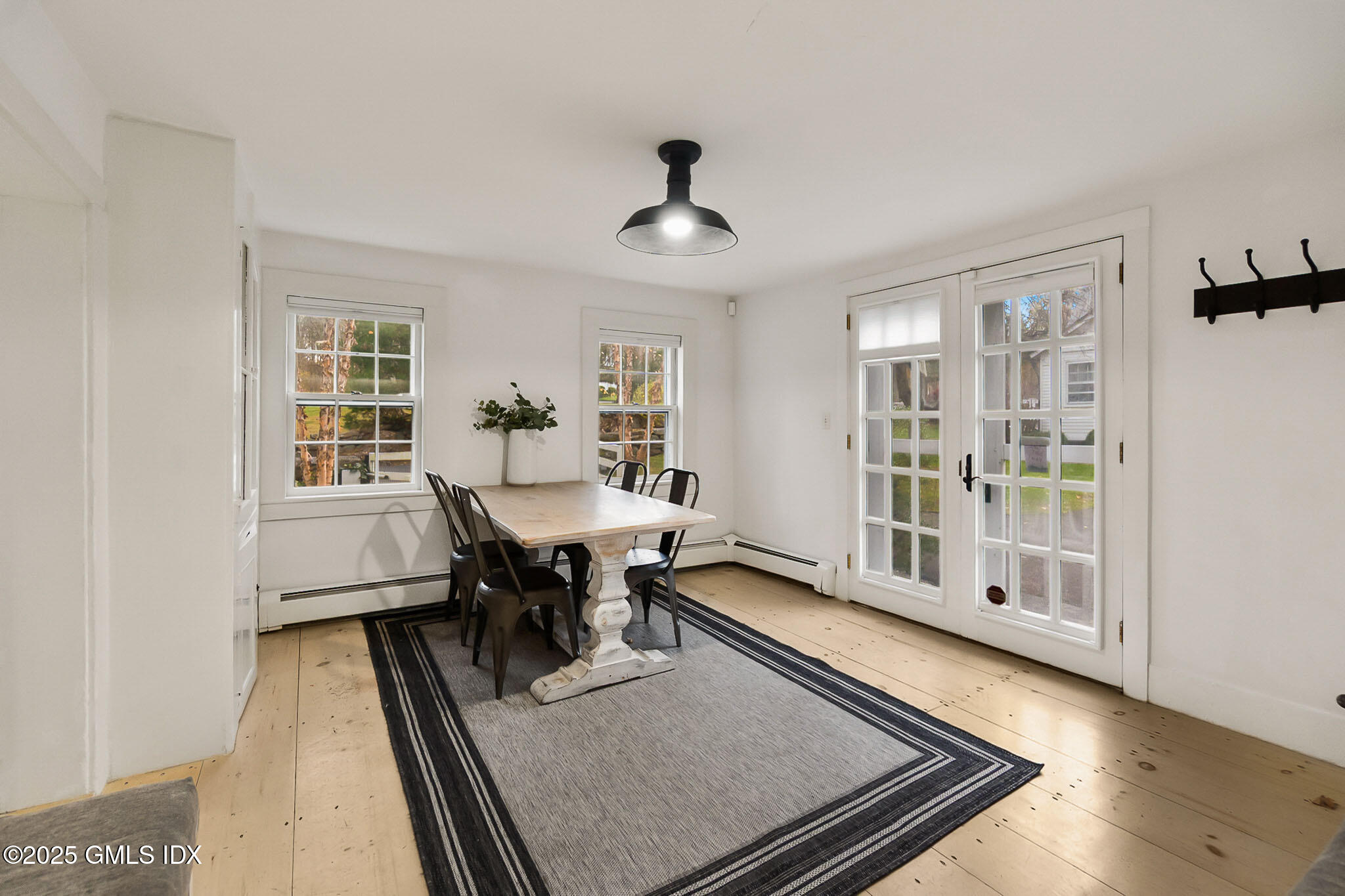 45 Burying Hill Road, Unit COTTAGE Greenwich, CT 06831 - Photo 8 of 19 a living room with furniture rug and window