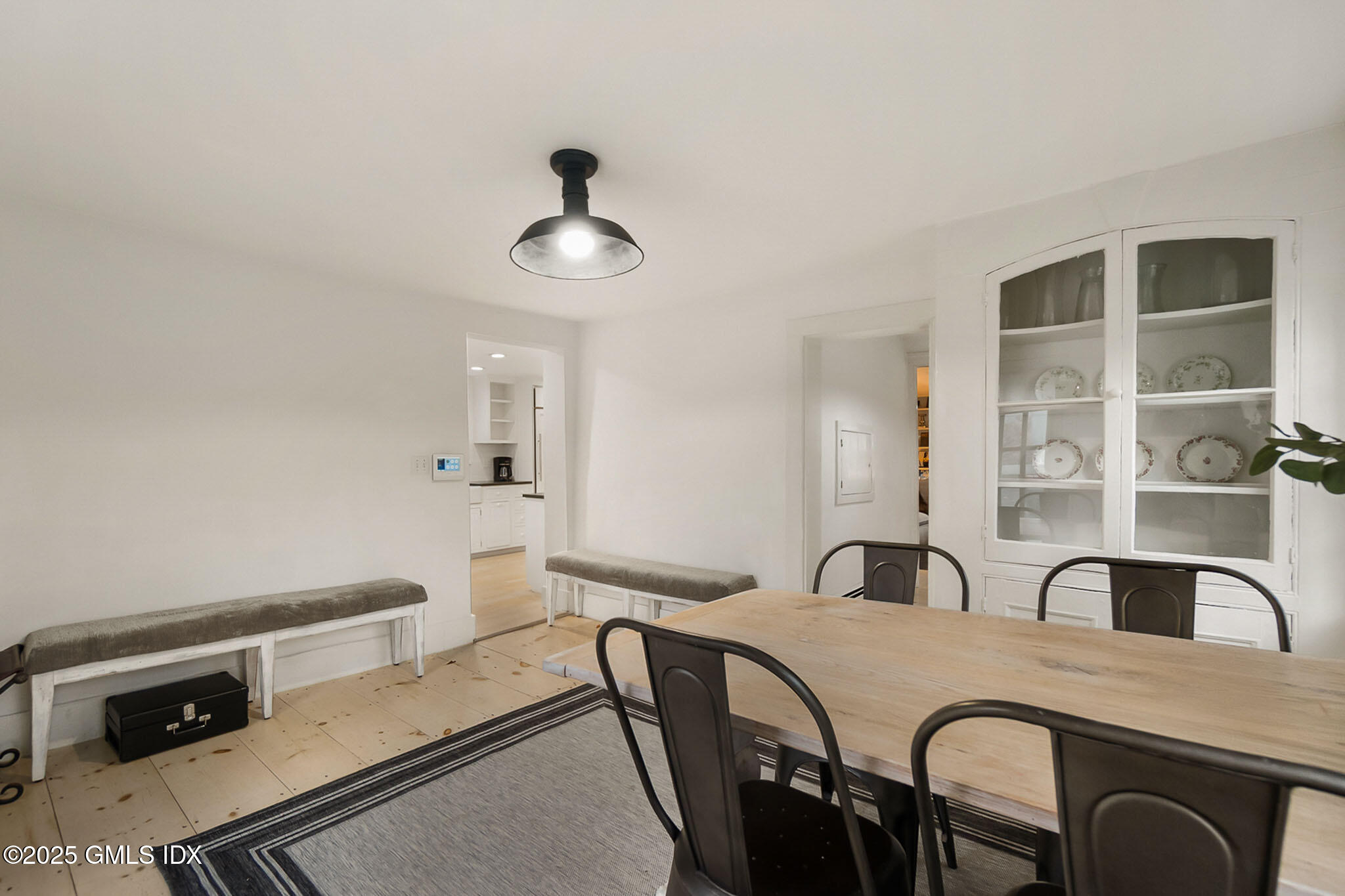 45 Burying Hill Road, Unit COTTAGE Greenwich, CT 06831 - Photo 9 of 19 a dining room with furniture and window